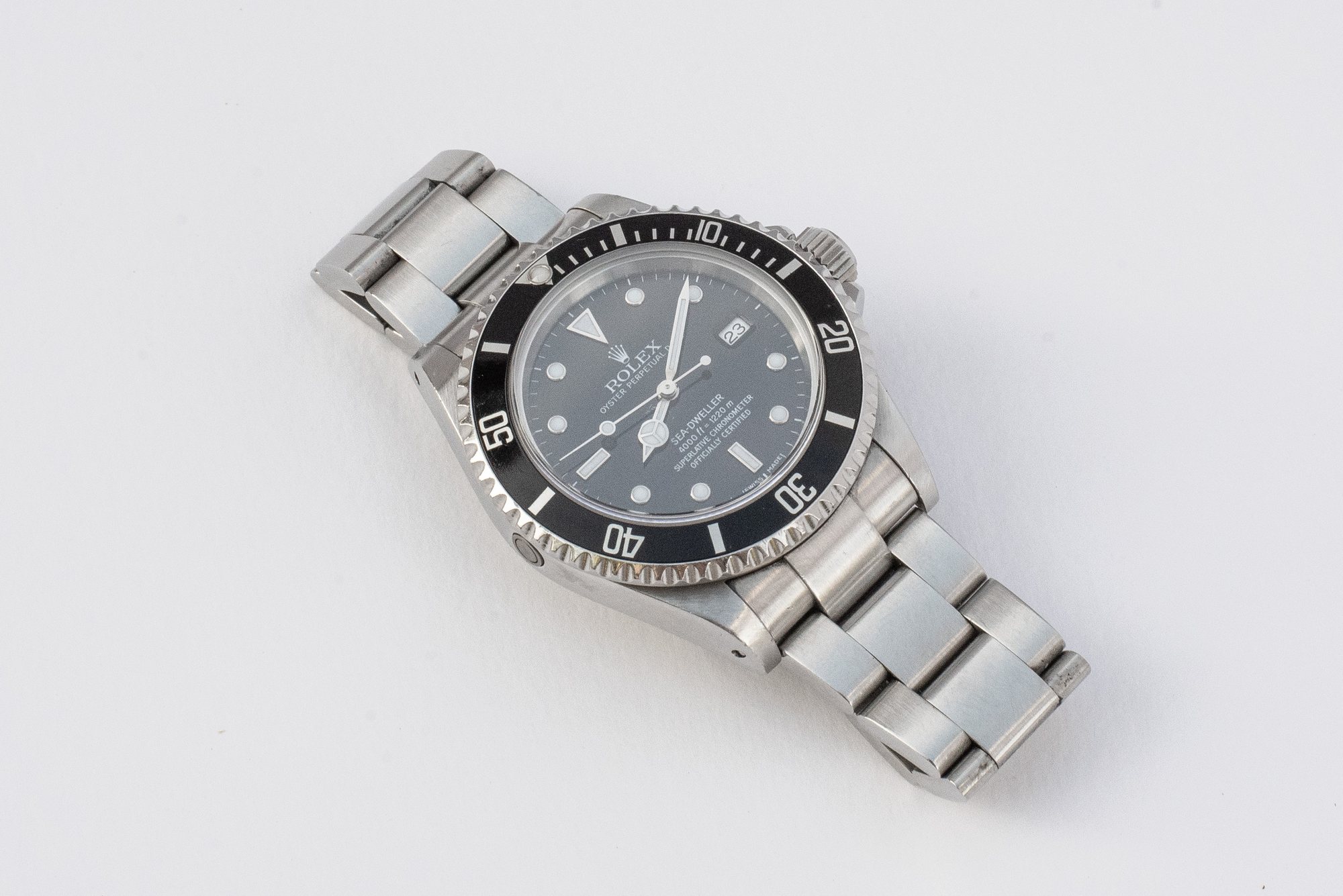 Rolex Sea-Dweller 16600 — close-up van wijzerplaat, bezel en kroon